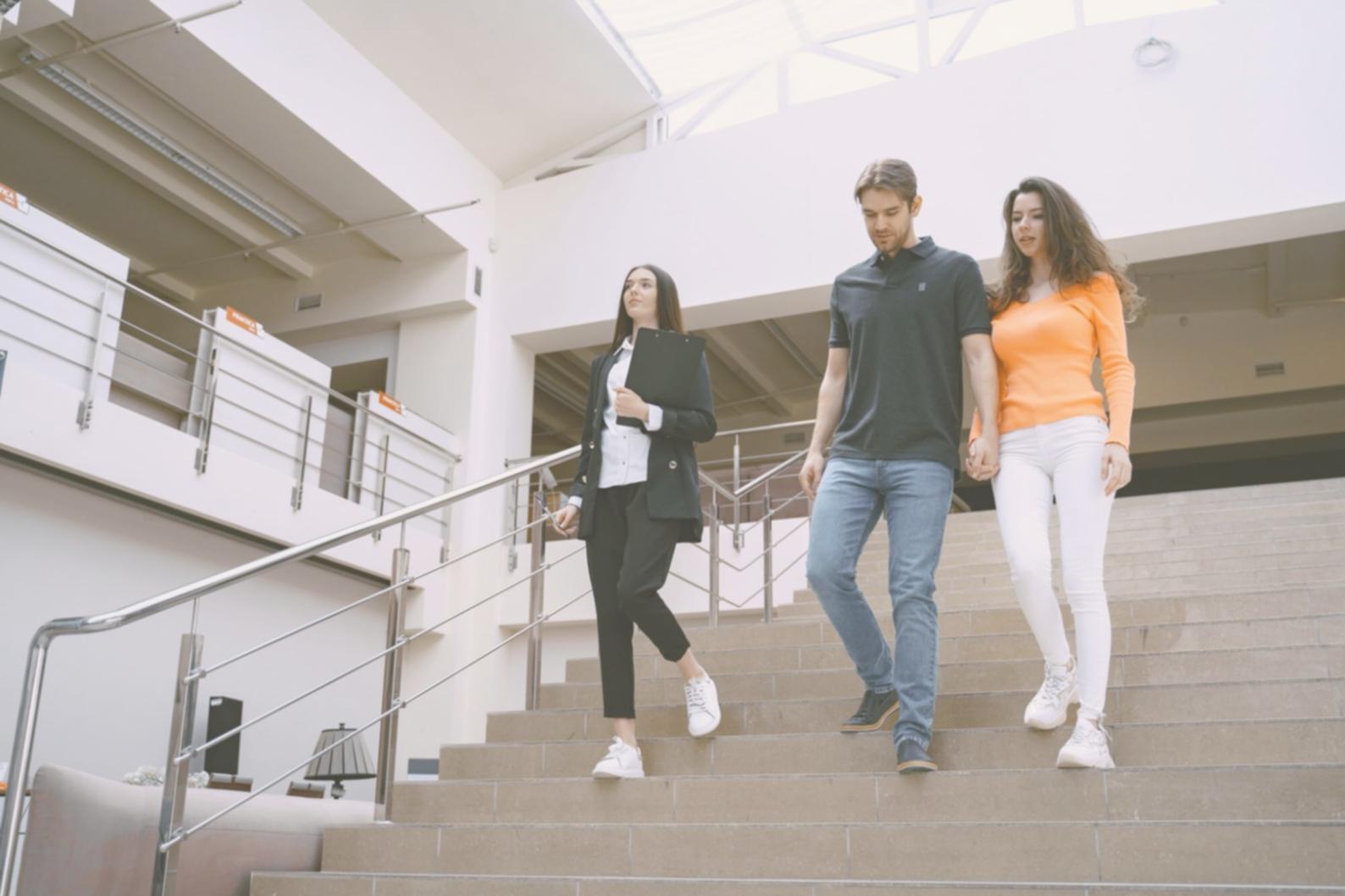 Students collaborating on financial modeling projects in modern classroom setting