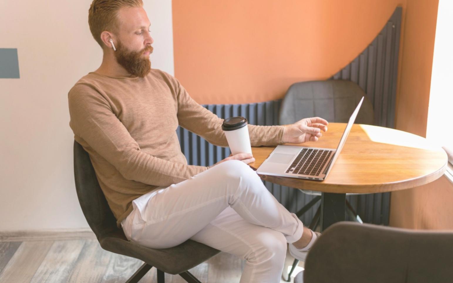 Professional financial modeling workspace with multiple monitors displaying financial data and spreadsheets